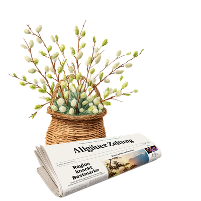 Gefaltete Ausgabe der Allgäuer Zeitung mit Schlagzeile 'Region knackt Bestmarke' und Bild eines Sonnenuntergangs